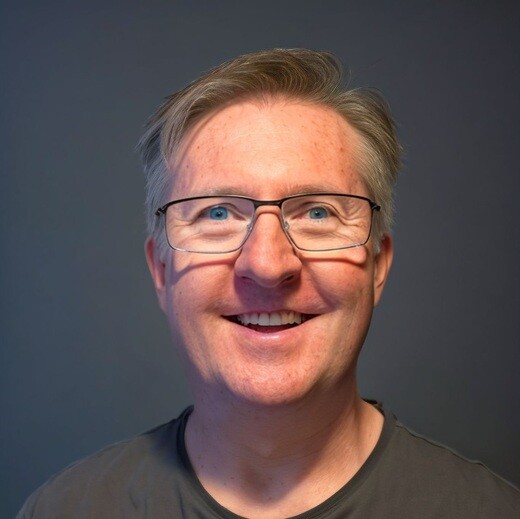 Headshot of a smiling man with glasses | Offshore Outsourcing | Parallel Outsourcing