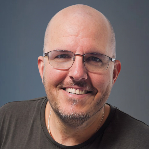 Headshot of a smiling bald man with glasses | Offshore Outsourcing | Parallel Outsourcing