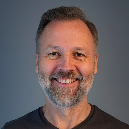 Headshot of a smiling bearded man | Offshore Outsourcing | Parallel Outsourcing