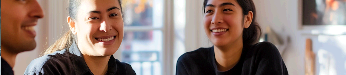 Three people smiling in a bright room | Offshore Outsourcing | Parallel Outsourcing