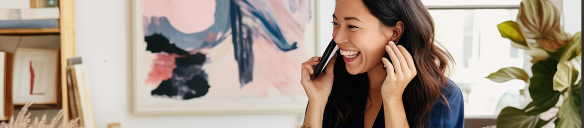 Smiling woman on the phone indoors | Outsource Payroll | Parallel Outsourcing