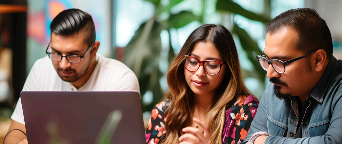Three people with glasses looking at a laptop | Outsource It Services | Parallel Outsourcing