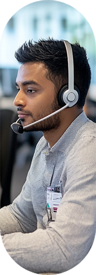 Man with headset working on computer | Outsourcing Of Customer Service | Parallel Outsourcing