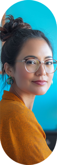 Woman with hair bun and glasses, smiling sideways | Offshore Outsourcing | Parallel Outsourcing