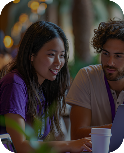 Young man and woman looking at a laptop screen | Outsource Digital Marketing | Parallel Outsourcing